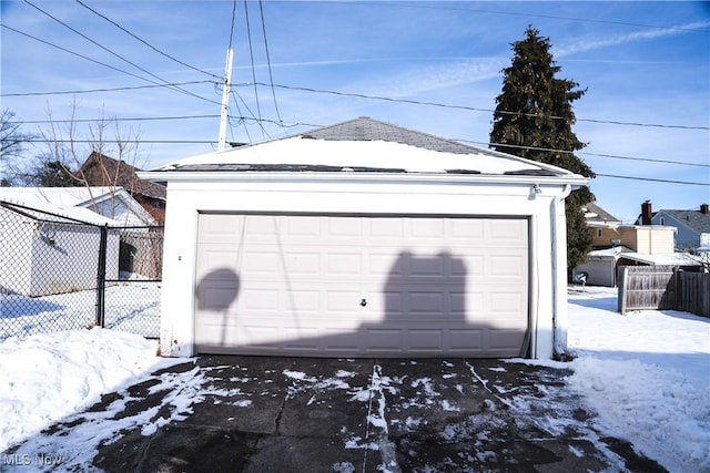 view of snow covered garage