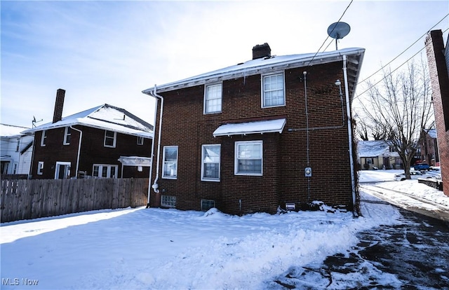 view of snow covered house