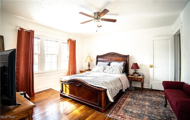 bedroom featuring dark hardwood / wood-style floors and ceiling fan