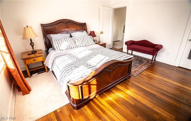 bedroom with wood-type flooring