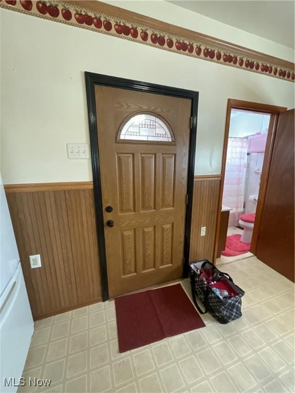 entrance foyer with wooden walls