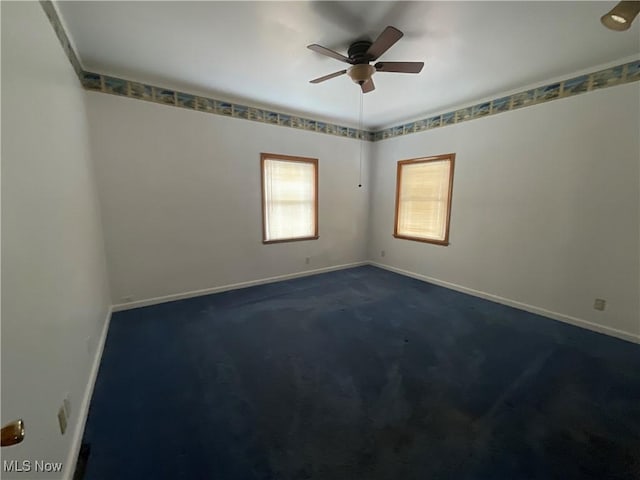 carpeted empty room with ceiling fan