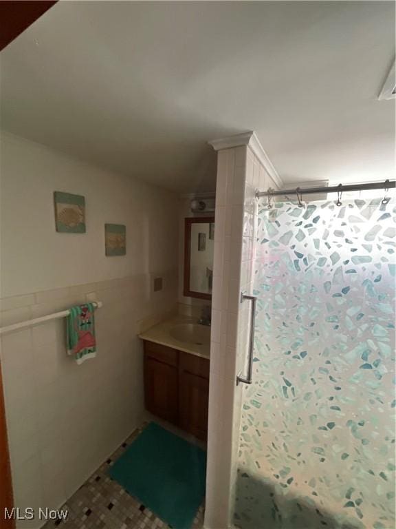 bathroom with vanity and lofted ceiling