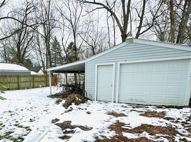 view of snow covered garage