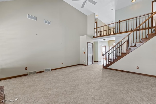 5420 Cloisters Dr, Canfield, OH 44406 - unfurnished living room featuring ceiling fan, carpet, high vaulted ceiling, stairway, and baseboards