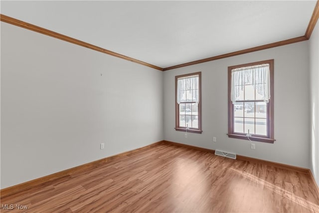 5420 Cloisters Dr, Canfield, OH 44406 - empty room with light wood finished floors, ornamental molding, and baseboards