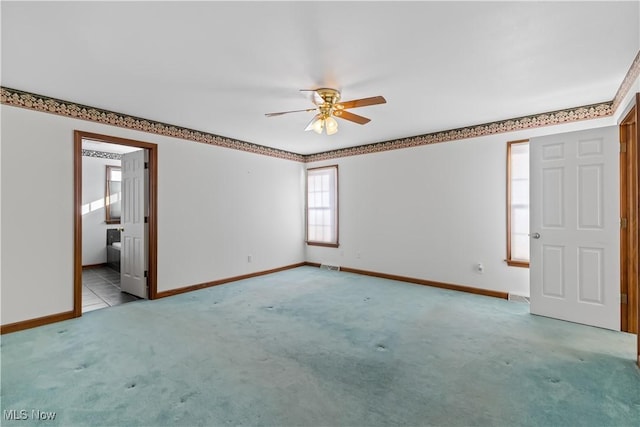 5420 Cloisters Dr, Canfield, OH 44406 - empty room with a ceiling fan, carpet floors, and baseboards