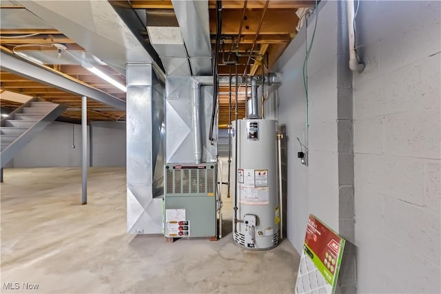 utility room featuring water heater and heating unit