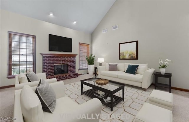 5420 Cloisters Dr, Canfield, OH 44406 - living area with baseboards, light carpet, a brick fireplace, and high vaulted ceiling