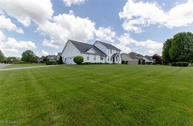 5420 Cloisters Dr, Canfield, OH 44406 - view of front facade with a front yard, a garage, and driveway