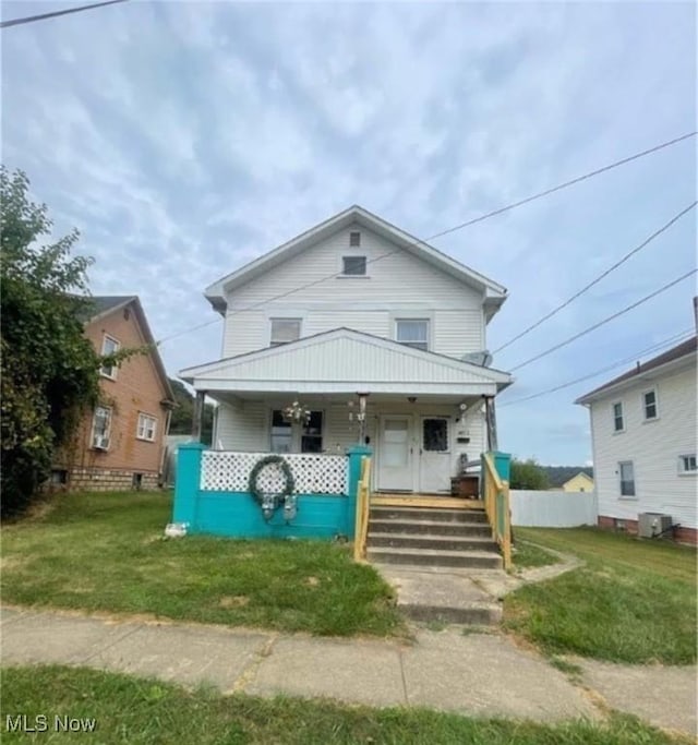 bungalow featuring a front yard and covered porch