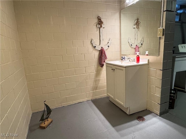 bathroom with vanity and concrete floors