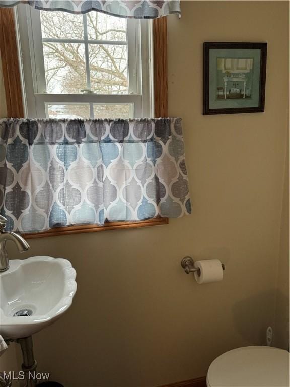 bathroom with toilet and sink