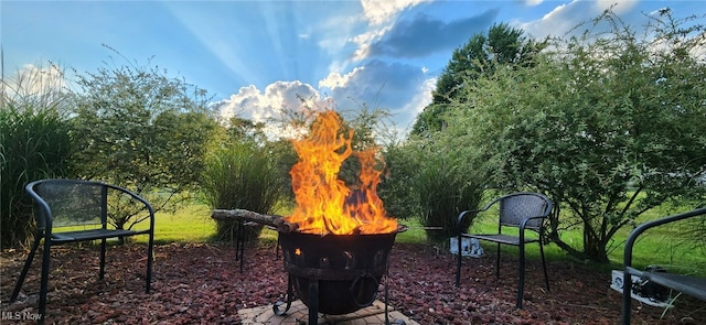 view of community with an outdoor fire pit