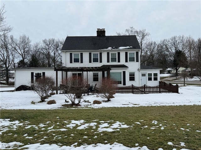 view of front of home featuring a lawn and a pergola