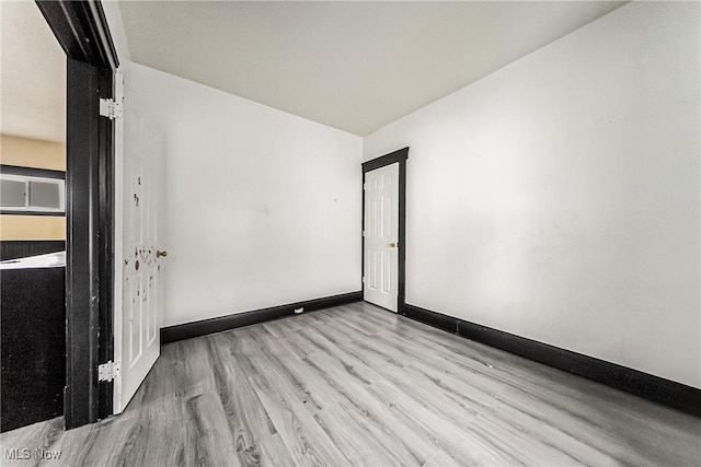 unfurnished room featuring light hardwood / wood-style floors