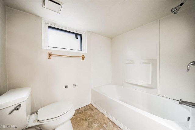 bathroom with shower / bathtub combination and toilet