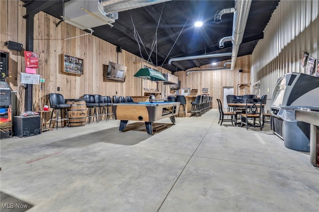 recreation room featuring concrete floors