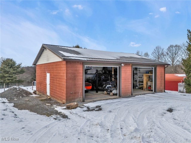 view of snow covered garage