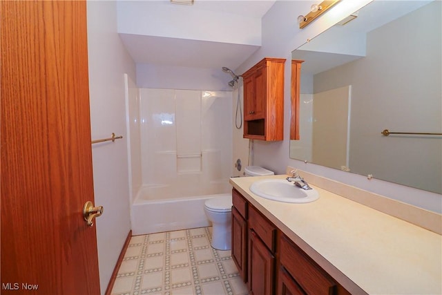 full bathroom featuring vanity, bathtub / shower combination, and toilet