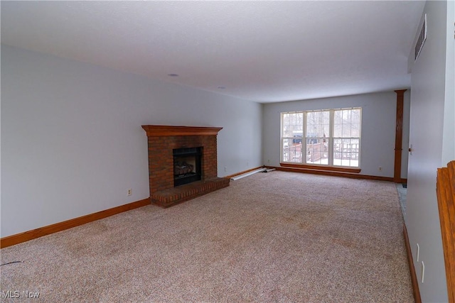 unfurnished living room with a fireplace and light colored carpet