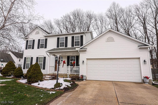 view of front of home with a garage and a porch