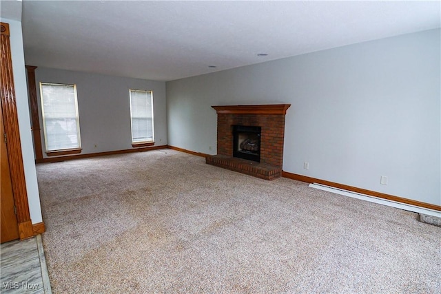 unfurnished living room with a brick fireplace and light colored carpet