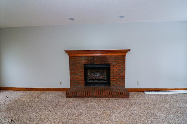 unfurnished living room featuring a brick fireplace and carpet floors