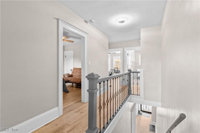 hallway with light hardwood / wood-style flooring