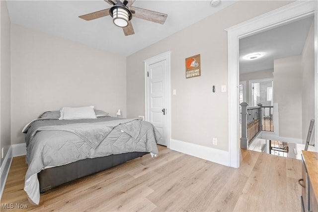 bedroom with ceiling fan and light wood-type flooring