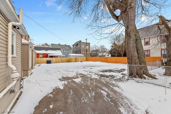 view of yard layered in snow