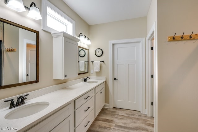 bathroom featuring vanity and hardwood / wood-style floors