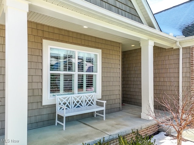 property entrance with covered porch