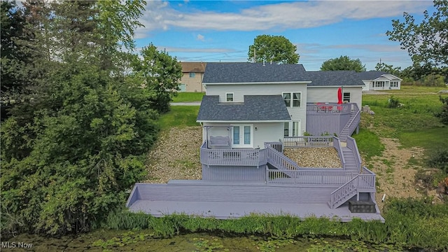 back of property with a wooden deck