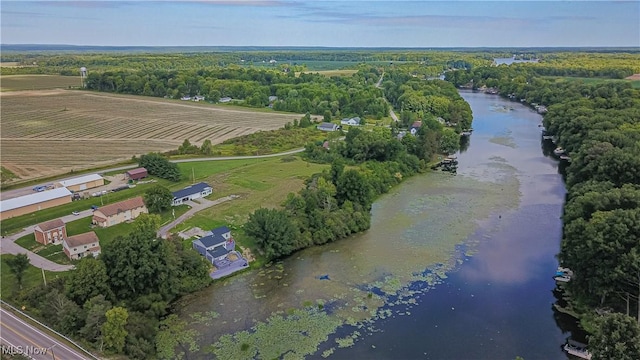 birds eye view of property featuring a rural view and a water view