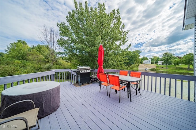 wooden terrace featuring area for grilling