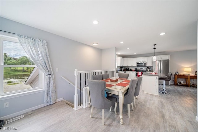 dining room featuring light hardwood / wood-style floors