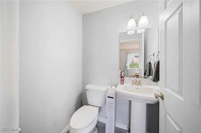 bathroom with toilet and sink