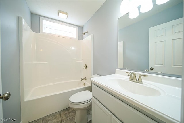 full bathroom with shower / tub combination, vanity, tile patterned floors, and toilet