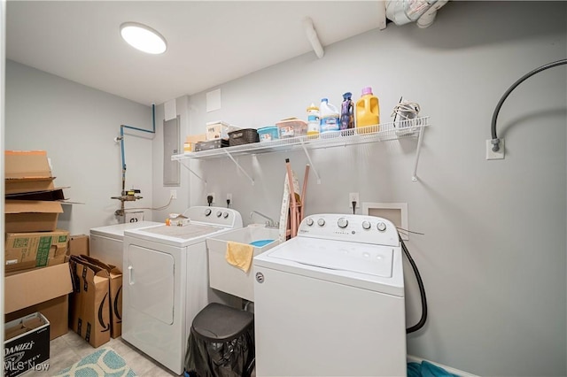 laundry room featuring sink, electric panel, and independent washer and dryer