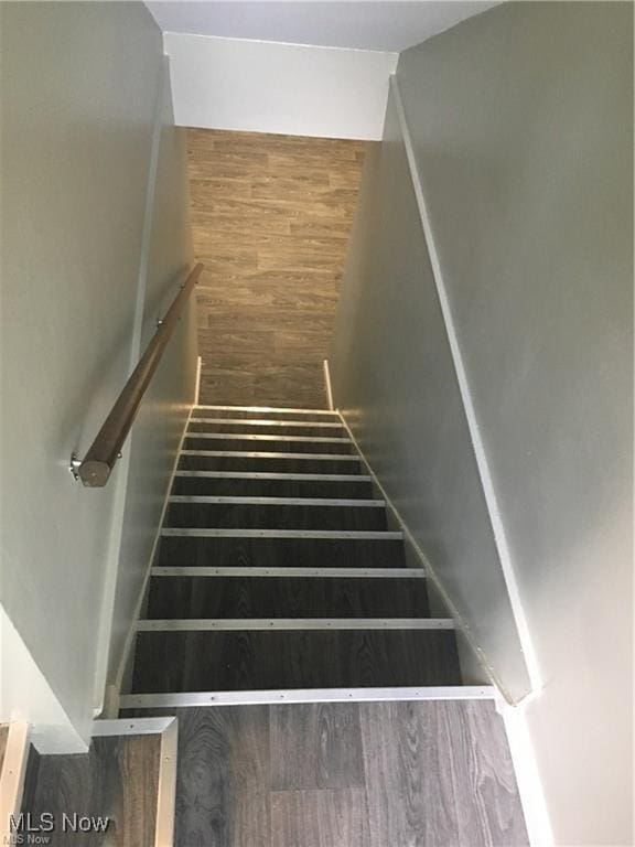 stairway featuring hardwood / wood-style floors