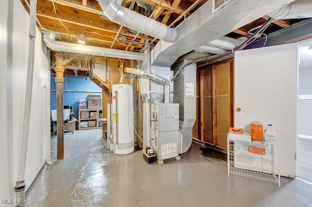 basement featuring heating unit and gas water heater