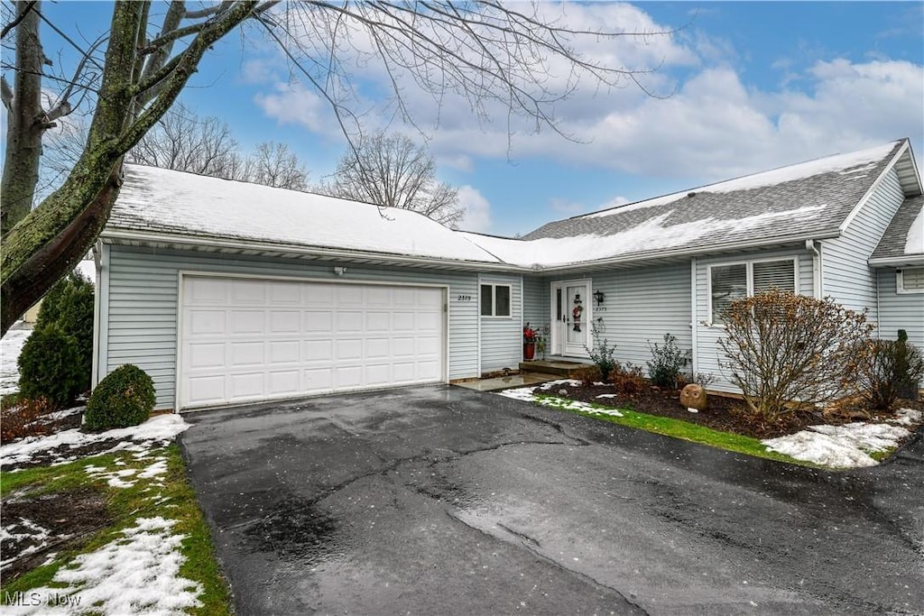 ranch-style home with a garage