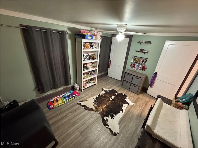 bedroom featuring ceiling fan and light hardwood / wood-style floors