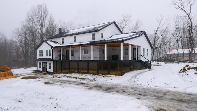 view of snow covered house