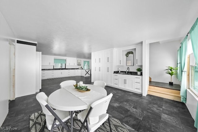 dining space featuring wet bar