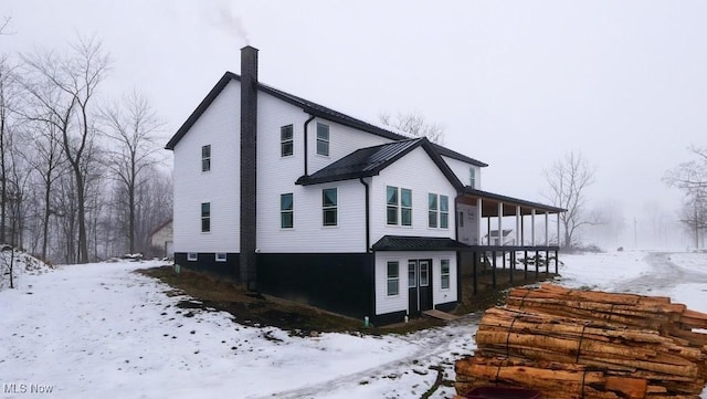 view of snow covered property