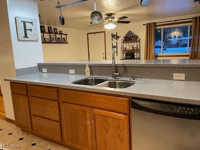 kitchen featuring sink, dishwasher, and ceiling fan