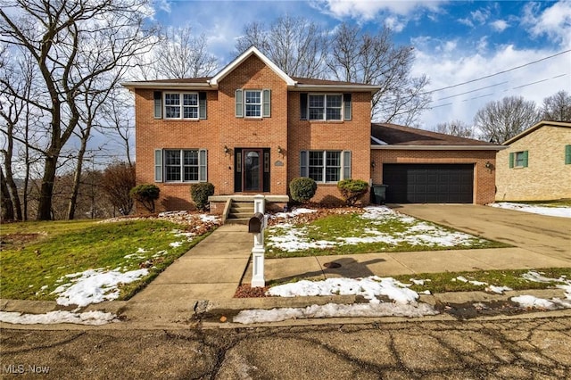 view of front of home featuring a garage and a front yard