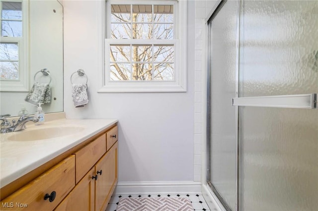 bathroom with vanity and an enclosed shower